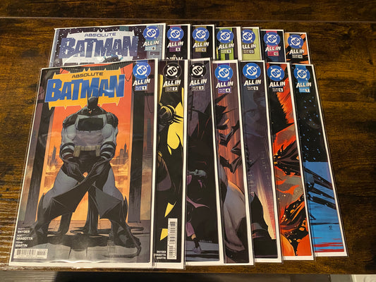 Collection of comic books featuring Batman on a wooden surface